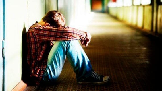 Depressed young man contemplating suicide Canada mishandling mental illness crisis