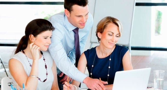 Office workers staring at computer The Pygmalion factor: Ensuring your employees’ success