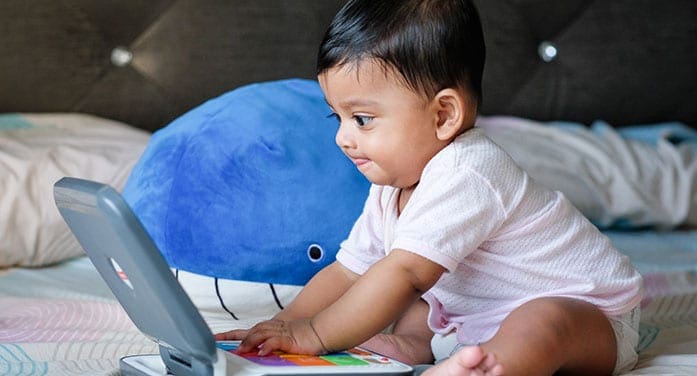 baby boy playing toy infant Study finds link between gut bacteria and enhanced cognition in infant boys
