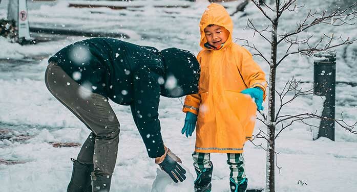 snow playing outdoors kids children family parent winter weather
